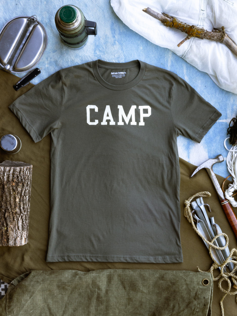 Camp T-Shirt styled with hiking gear, ready for an outdoor adventure.